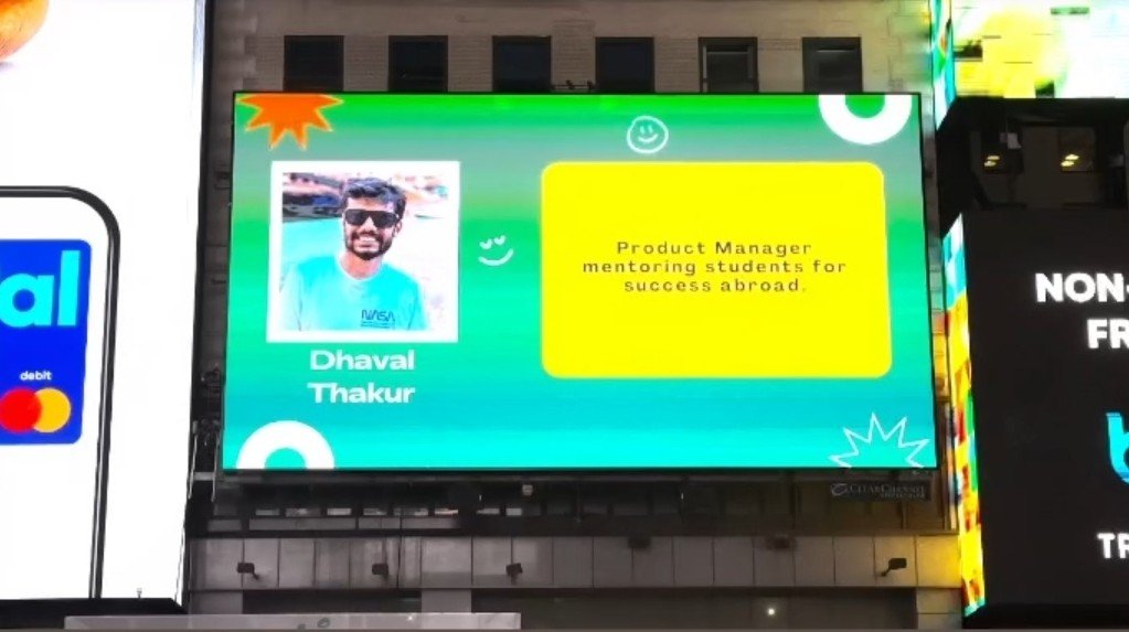 Dhaval Thakur featured on a Times Square billboard: Product Manager mentoring students for success abroad